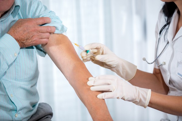 administering a flu vaccination